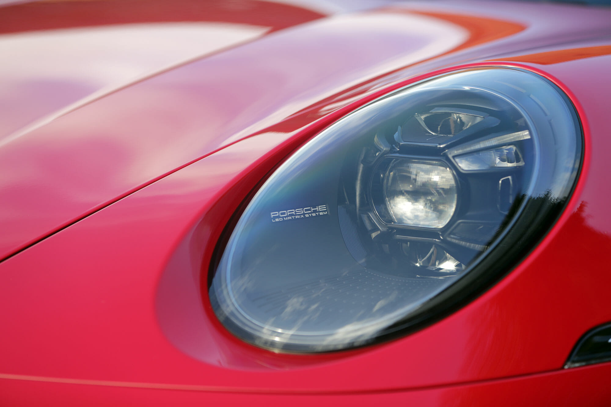 Porsche 911 GTS 22 in Carmine Red Headlight Detail